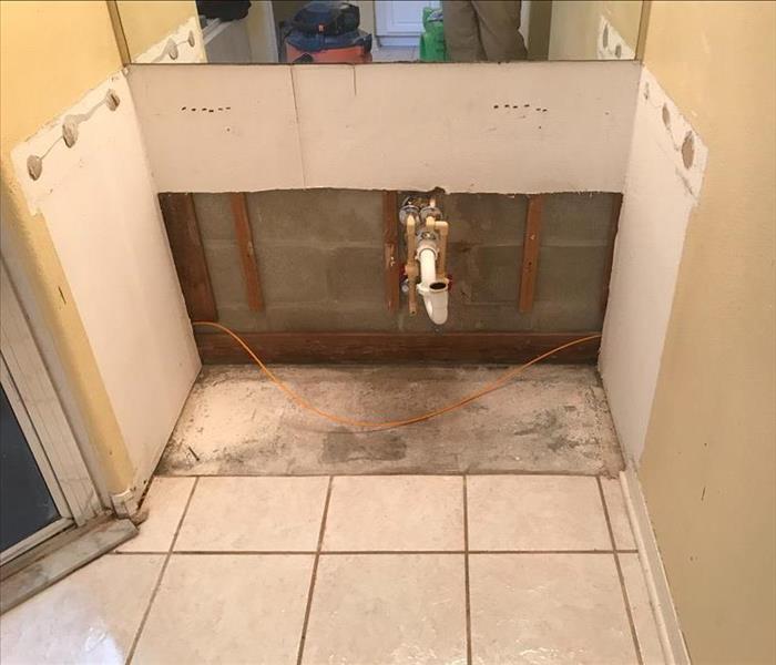 bathroom sink removal when water damage was found in plumbing pipes