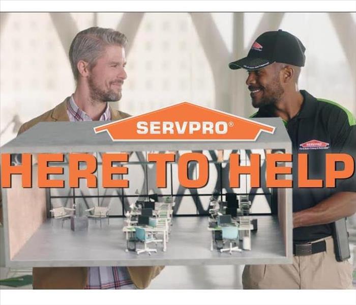 SERVPRO technician with customer 